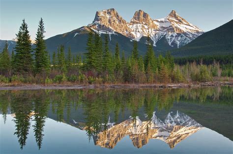Three Sisters Mountain Peaks Reflection By Rebecca Schortinghuis