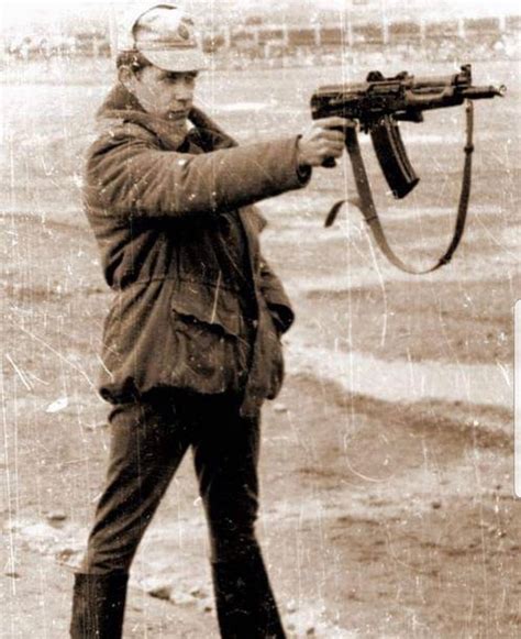 A Soviet Soldier Firing An Aks 74u One Handed During Target Practice In