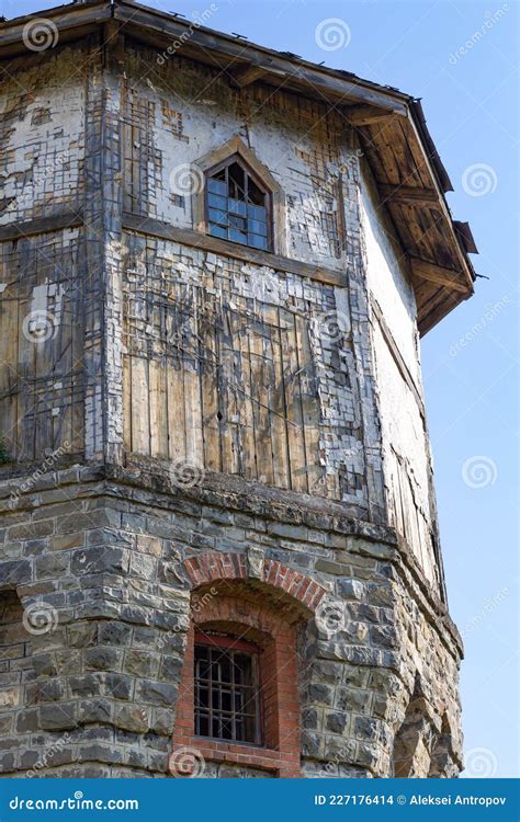 The Upper Part Of An Ancient Watchtower Made Of Stone Blocks And Wood