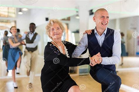 Mature Woman Dancing Swing With Young Man Stock Photo Image Of School
