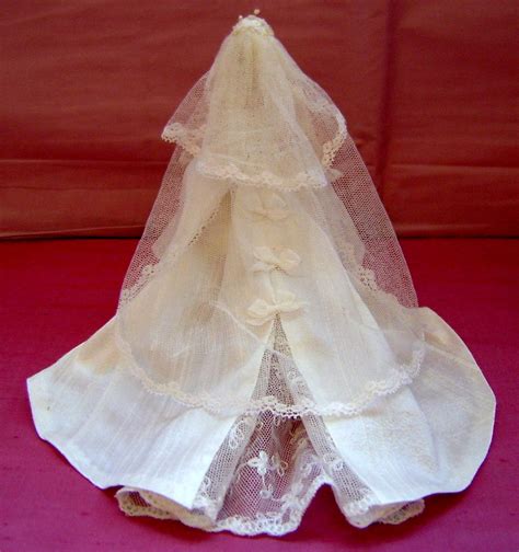 The wedding dress consisted of a rounded collar, full skirt of ivory peau de soie, and a fitted bodice made from brussels. PRINCESS GRACE WEDDING GOWN BACK - Angeliqueminiatures Blog