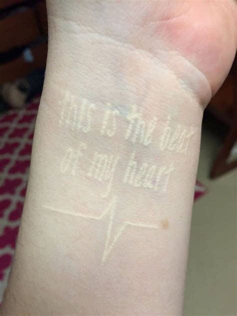 The uv butterfly looks resting on the back at day time. 150 Best White Ink Tattoos in the USA This Year - Wild ...