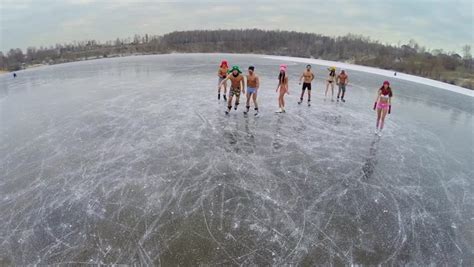 Several Naked Babe People Get Fun On Icy Pond At Winter Day Aerial View Stock Footage Video