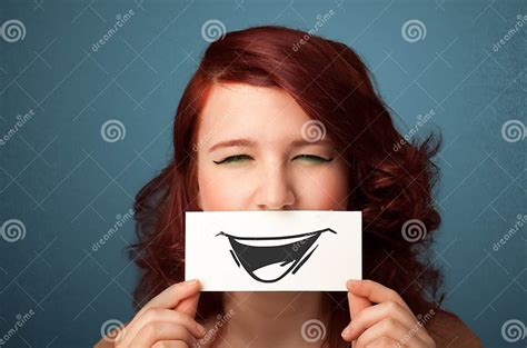 Happy Cute Girl Holding Paper With Funny Smiley Drawing Stock Image