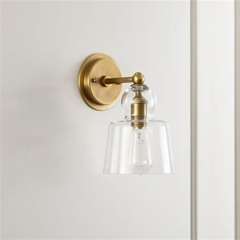 How bathroom sconces can add to your bathroom's design finding the right balance between ambient, task and accent lighting is difficult without the use of bathroom wall sconces.while ambient lighting can be easily provided by a bathroom ceiling light, creating task lighting solely with vanity light can sometimes leave your lighting unequal. Lander Brass Sconce | Crate and Barrel