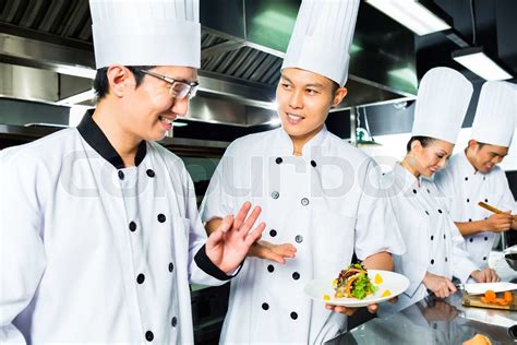 asian chef in restaurant kitchen cooking stock image colourbox