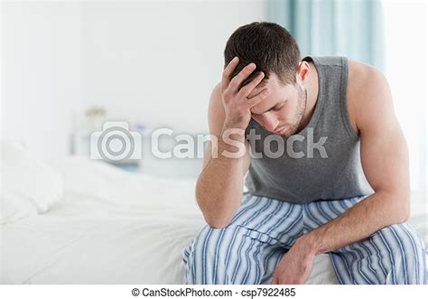Stock Images Of Sad Man Sitting On His Bed With His Head On His Hand