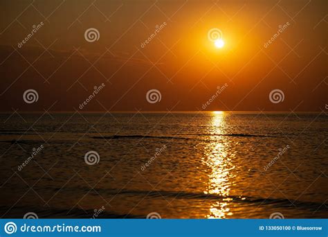 Dramatic Red Orange Colored Sunset Over The Calm Sea At Summer Stock Photo - Image of reflection ...