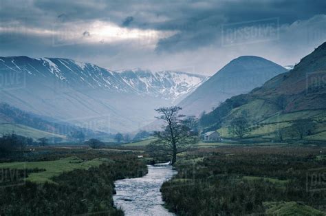 Storm Clouds Over Snow Capped Mountains At Martindale The Lake
