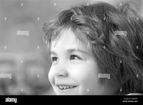 Close Up Portrait Of An Excited Little Boy Laughing Stock Photo Alamy