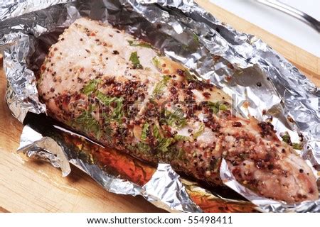 Grab a large section of aluminum foil and spray well with cooking spray. Pork Tenderloin Grilled In Aluminum Foil Stock Photo ...