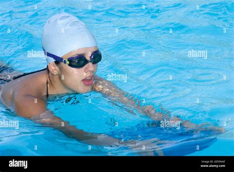 Young Woman Practicing Swimming In A Swimming Pool Stock Photo Alamy
