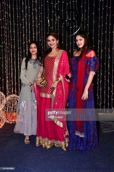 Actress Madhoo Shah With Daughters Ameya And Keia Pose As They Arrive