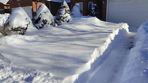 The Driveway Is Covered With Deep White Snow In Canada For A Weather Or