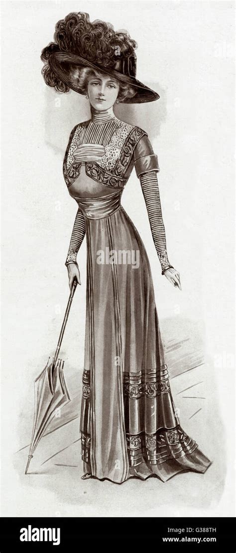 woman wearing merry widow hat with plumes and pretty tunic frock with rat s tail embroideries in