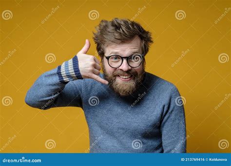 Funny Shaggy Haired Bearded Man Wearing Glasses And A Sweater Knitted