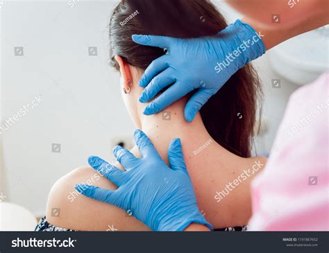 Doctor Dermatologist Examines Birthmark Patient Checking Stock Photo