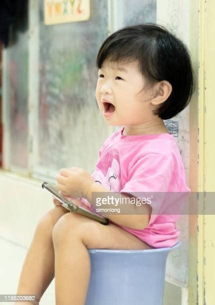 Girl Peeing On Toilet Stock Fotos Und Bilder Getty Images