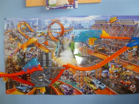 The building game puts you in control of racing cars in the arena. Madhouse Family Reviews: Hot Wheels Wall Tracks Mid Air ...