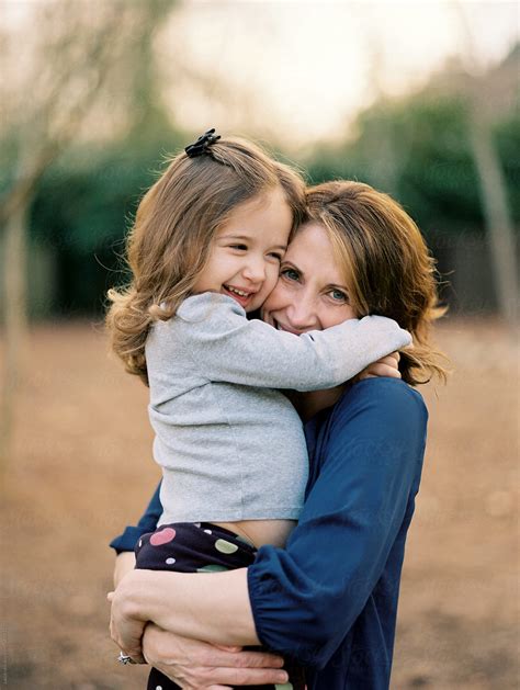 Mother And Daughter Holding Each Other And Smiling By Stocksy Contributor Jakob Lagerstedt
