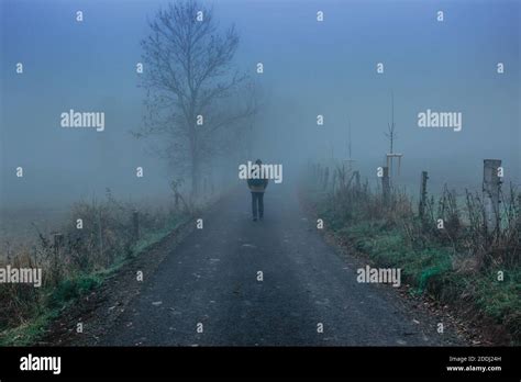 Man Walking On Scary Misty Road Moody Blue Fogmystical Fantasy