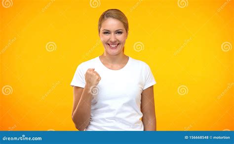 Pretty Female In White T Shirt Showing Yes Gesture Achievement Sign