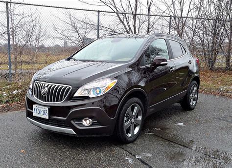 The buick encore returns for 2014 with new safety features that complement the luxury amenities, refinement and signature buick style for this unique crossover. 2014 Buick Encore | Our review of the Encore www.thestrada ...