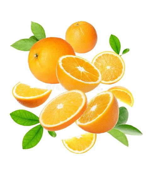 Cut And Whole Oranges With Green Leaves Flying On White Background