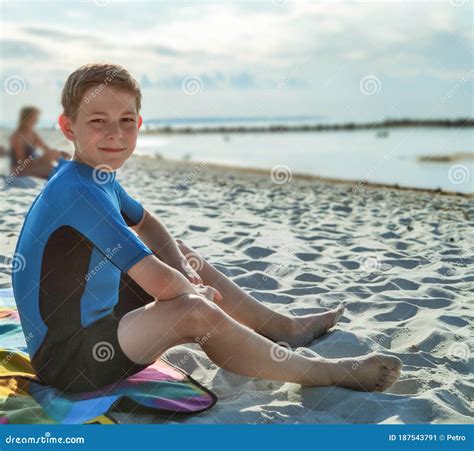 Handsome Teen Boy In Neoprene Swimsuit In Baltic Sea Stock Image