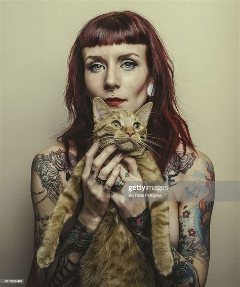 Tattooed Model Holding Cat Photo Getty Images
