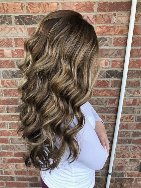 Brown hair with highlights and lowlights. Curls, long hair, hair dos