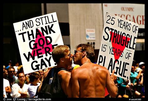 picture photo gay couple with signs during the gay parade san francisco california usa