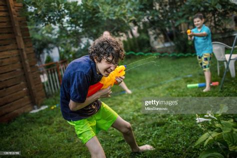 Water Fight In Our Yard High Res Stock Photo Getty Images