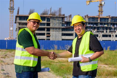 Engineer And Contractor Successful Deal Handshake On Construction Site