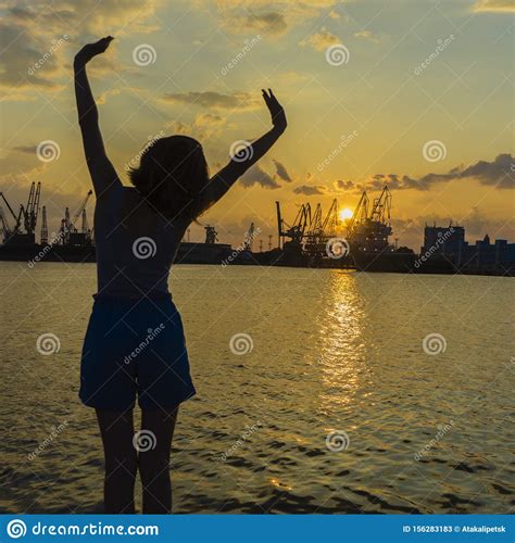 Strong Confidence Woman Open Arms Under The Sunrise At Seaside Stock