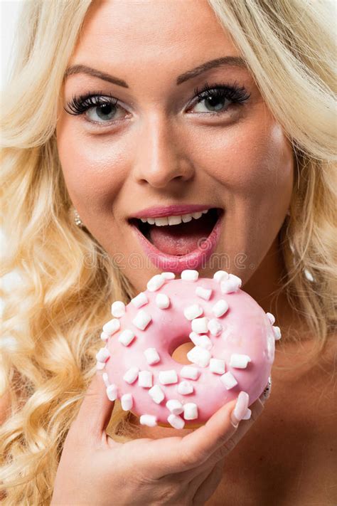 woman happy to eat a pink donut stock image image of happiness gluttonous 70781949