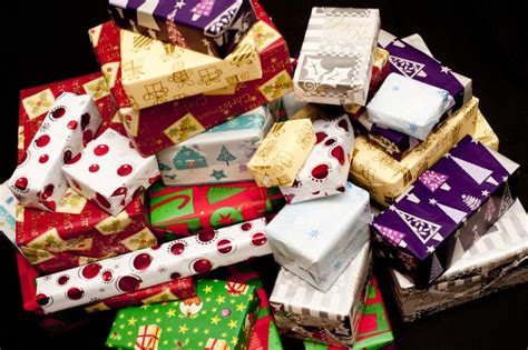 100 great ideas for all budgets. Photo of Pile of colorful gift wrapped Christmas gifts ...