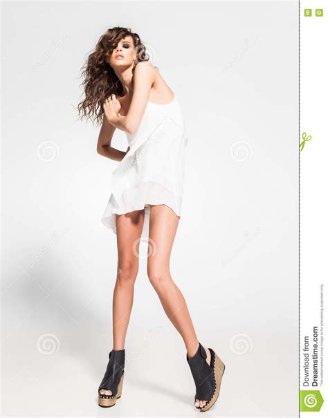 Full Body Of Beautiful Woman Model Posing In White Dress In The Studio ...