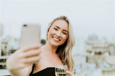 Premium Photo Cheerful Woman Taking A Selfie At A Rooftop Party