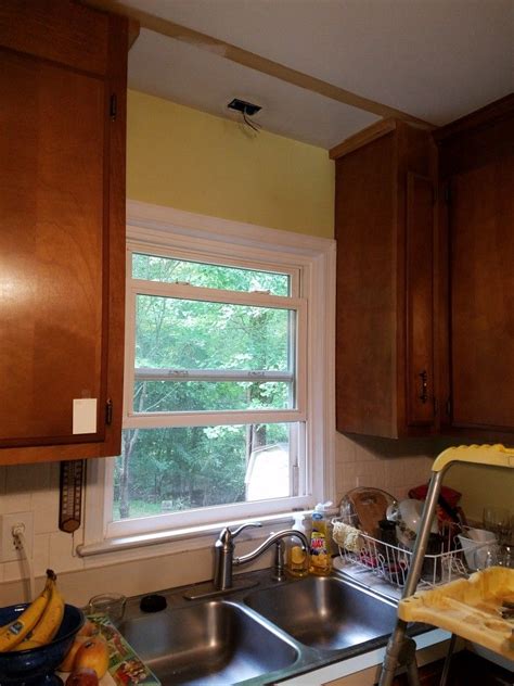 Melodie did that in her kitchen and it looks great: Cabinet valance and light removal 4 | Kitchen remodel ...