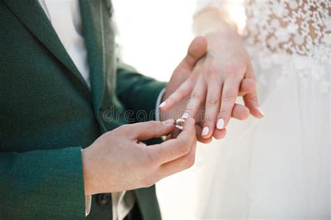 Groom Wears Ring On Bride`s Finger Wedding Day Stock Photo Image Of