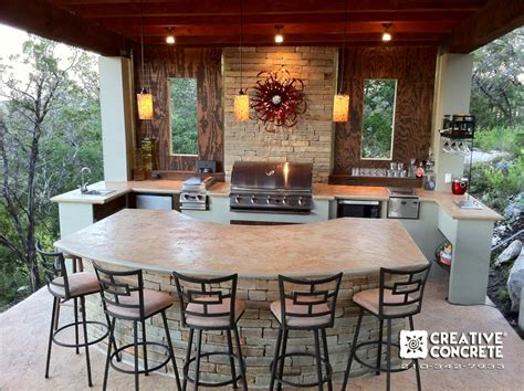 Granite, marble, concrete, soapstone, tile and others for outdoor concrete is also a durable material for outdoor kitchen countertops. Outdoor kitchen built by Creative Concrete ®. Concrete ...