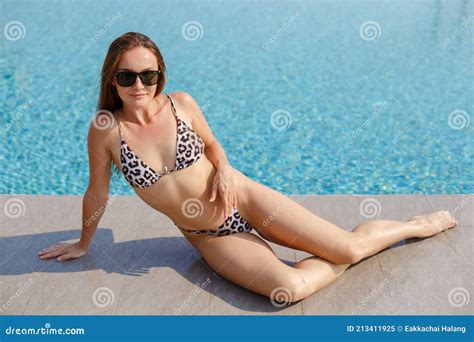 Beautiful Woman Wear Bikini And Sunglasses Sitting Relax Time At Poolside Lifestyle Travel In