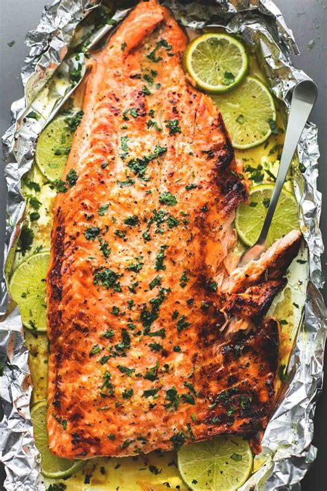 Loaded with vibrant fresh flavor and perfect for a weeknight meal! Baked honey cilantro lime salmon in foil is cooked to ...