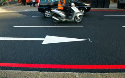 They are upright lines locating under the ring and little fingers. Red lines and no stopping - Transport for London