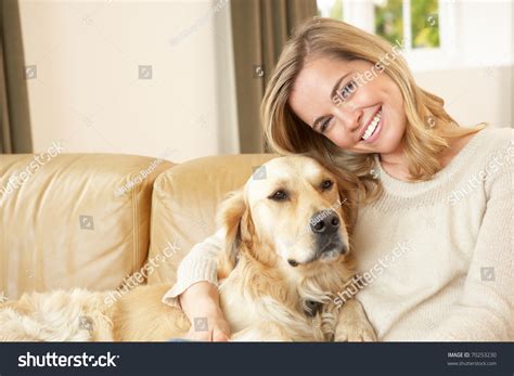 Young Woman With Dog Sitting On Sofa Stock Photo 70253230 Shutterstock