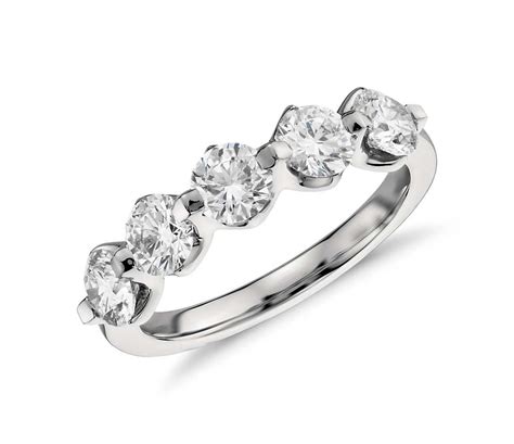Round and marquise diamonds extend one third of the way around the band creating an alluring pattern in this chic and distinctive ring. Five Stone Floating Diamond Ring in Platinum (1.5 ct. tw ...