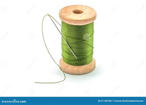Isolated Wooden Spool Of Green Thread And Needle Stock Photo Image Of
