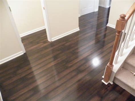 For a sleek and traditional look, pick a polished wood laminate floor. pergo laminate flooring installed | Gallery of Laminate Wood Flooring Cost | Flooring cost, Cost ...