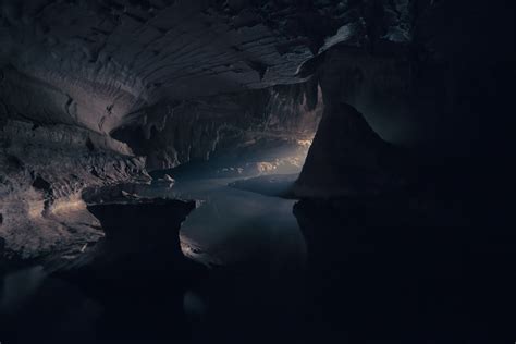Cave Interior With Body Of Water Photo Free Cave Image On Unsplash